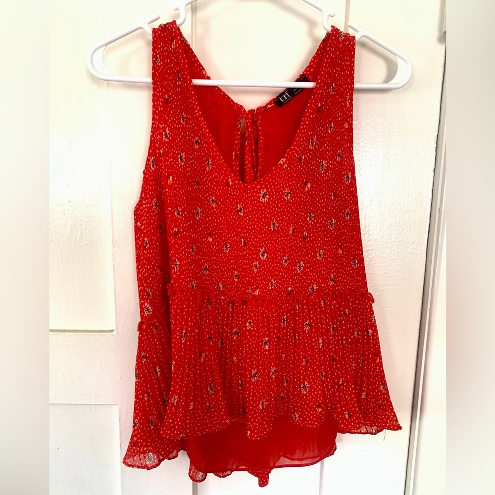 Zara orange and floral sleeveless flutter top